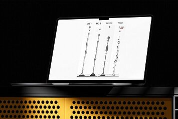 Microgels Laptop displaying different liquid jets from microgel solutions and water.